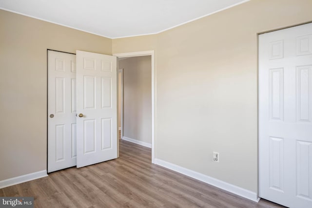 unfurnished bedroom featuring light hardwood / wood-style flooring