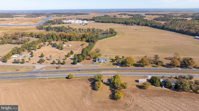 birds eye view of property with a water view and a rural view