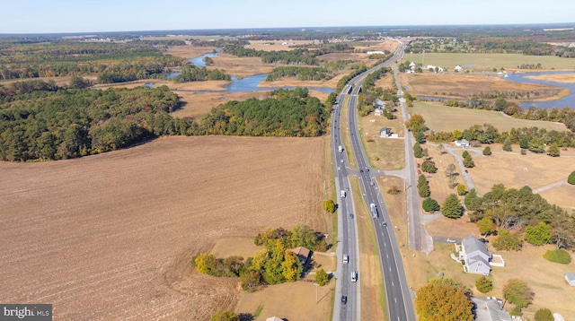 aerial view with a water view and a rural view