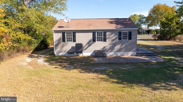 rear view of house with a lawn