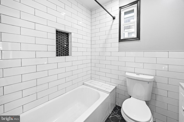 full bath with tile walls and toilet