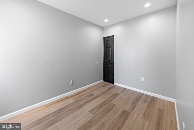 unfurnished room featuring recessed lighting, baseboards, and light wood-style flooring