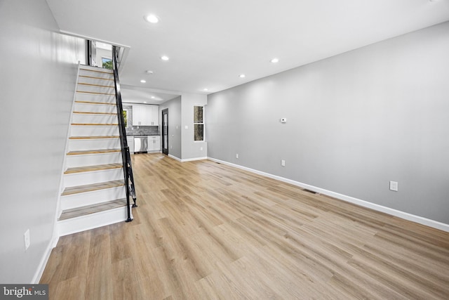 unfurnished living room featuring light hardwood / wood-style flooring