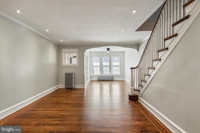 entryway featuring ornamental molding, dark hardwood / wood-style floors, and radiator