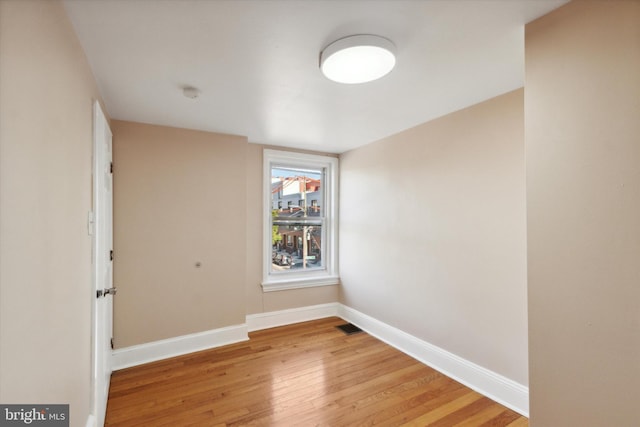 spare room featuring hardwood / wood-style floors