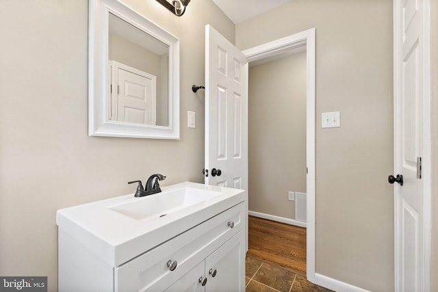 bathroom featuring vanity and wood-type flooring