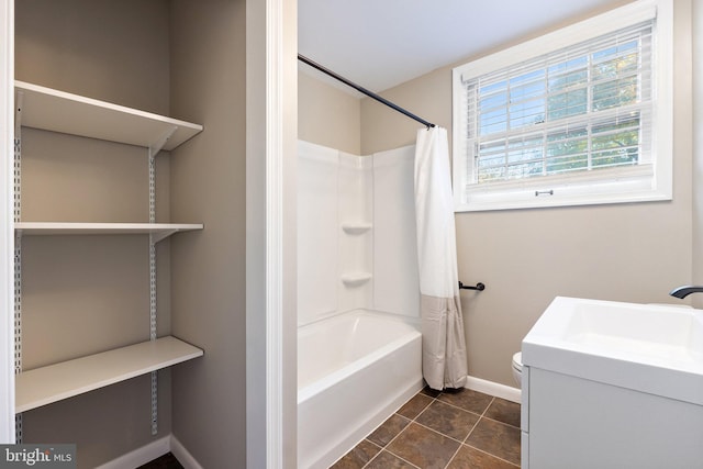 full bathroom featuring vanity, toilet, tile patterned floors, and shower / bath combo