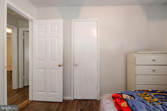 bedroom featuring dark wood-type flooring