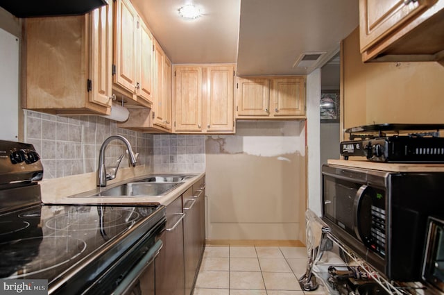 kitchen with black appliances, sink, light tile patterned flooring, backsplash, and light brown cabinets