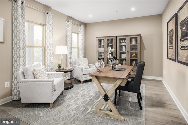 office space with light hardwood / wood-style flooring