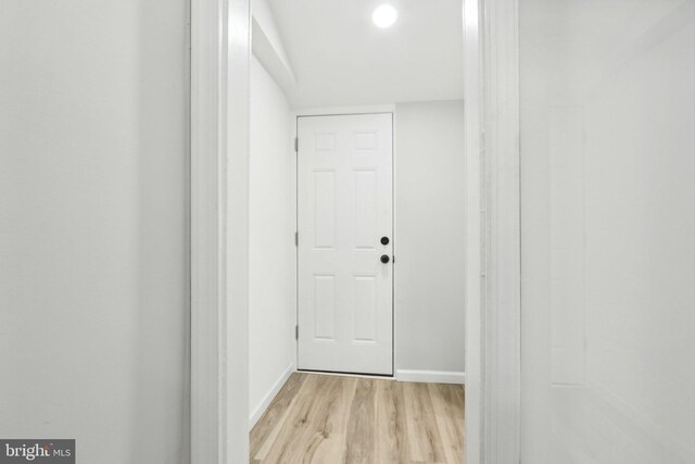 corridor featuring light hardwood / wood-style floors