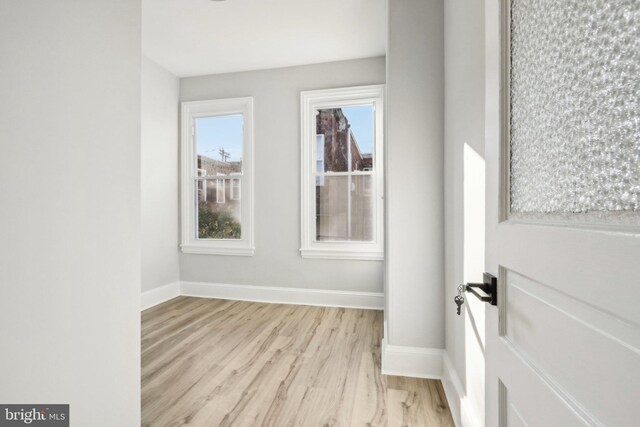 unfurnished room featuring light hardwood / wood-style floors