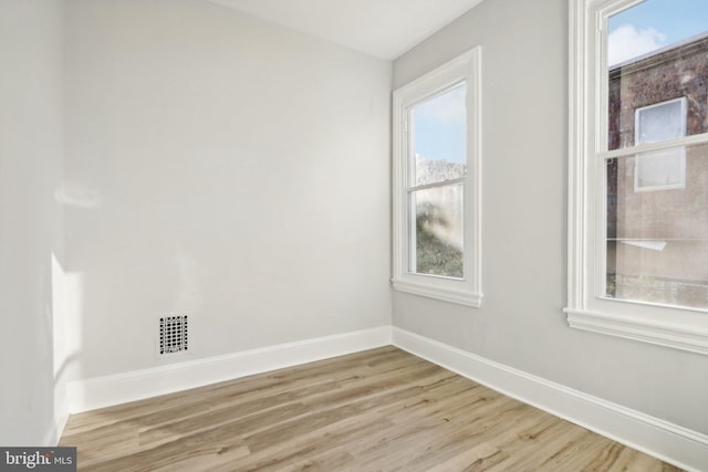 unfurnished room featuring light wood-type flooring