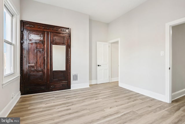 interior space featuring a healthy amount of sunlight and light hardwood / wood-style floors