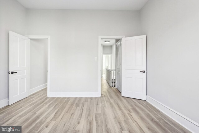 spare room featuring light wood-type flooring