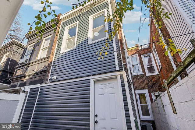 view of side of property with central AC unit