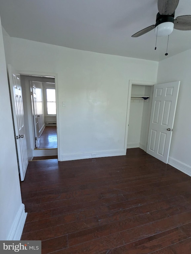 interior space with ceiling fan and dark wood-type flooring