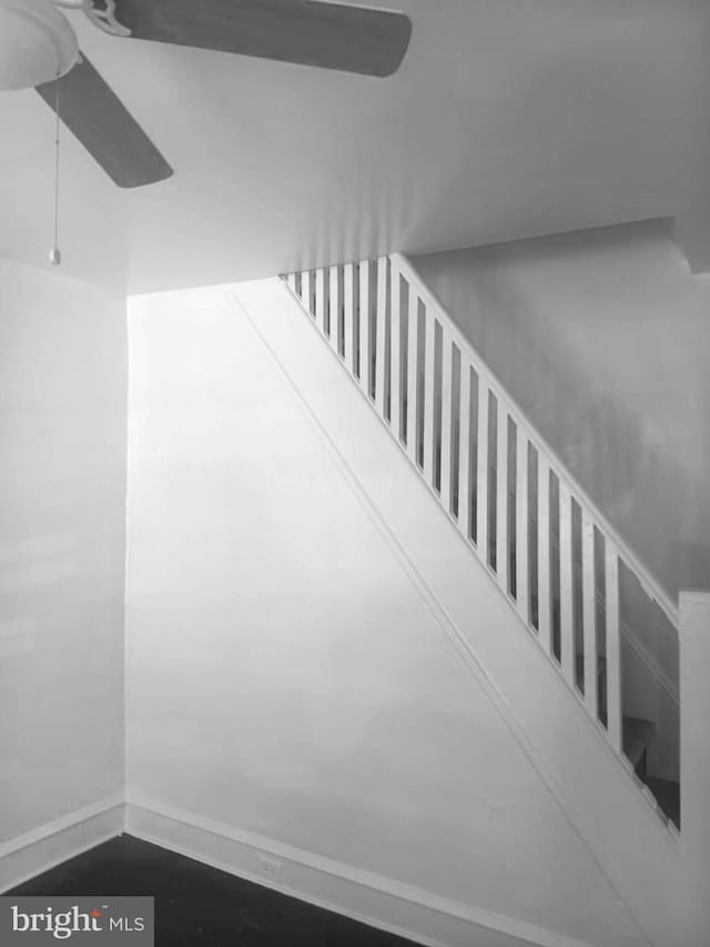 1909 E Wishart St, Philadelphia, PA 19134 - stairs featuring a ceiling fan and baseboards