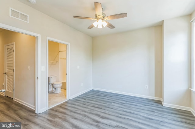 empty room featuring ceiling fan and wood-type flooring