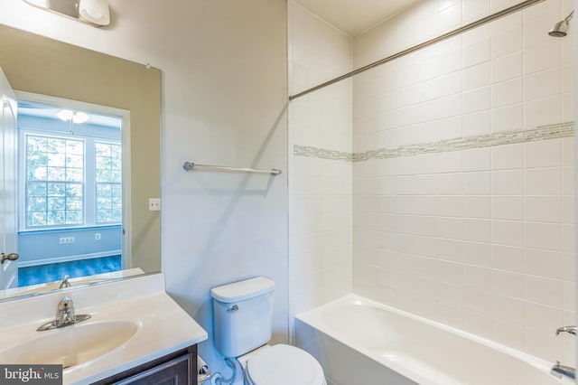 full bathroom featuring vanity, toilet, and tiled shower / bath combo