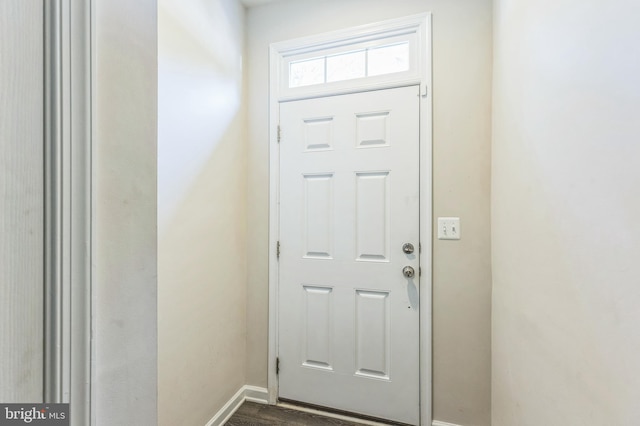 doorway featuring dark wood-type flooring