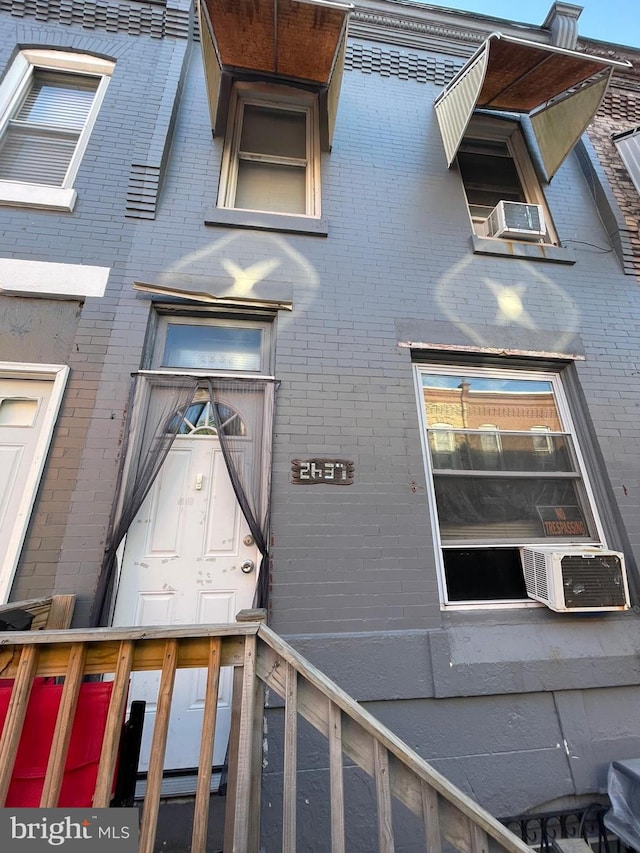 doorway to property with cooling unit