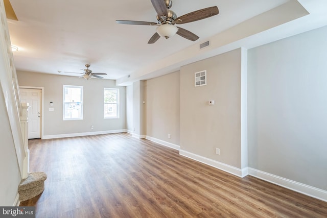 unfurnished room featuring ceiling fan and hardwood / wood-style flooring