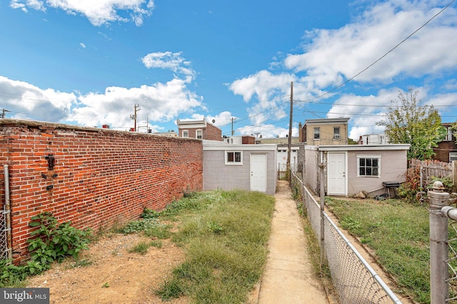 view of property exterior with an outdoor structure