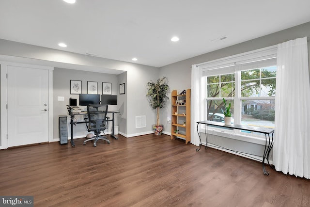 home office with dark hardwood / wood-style floors