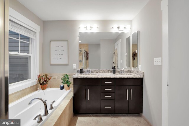 bathroom with shower with separate bathtub, tile patterned floors, and vanity