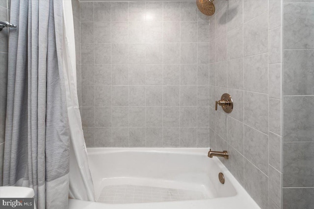 bathroom featuring shower / bathtub combination with curtain