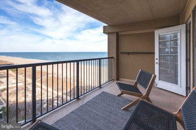 balcony with a view of the beach and a water view