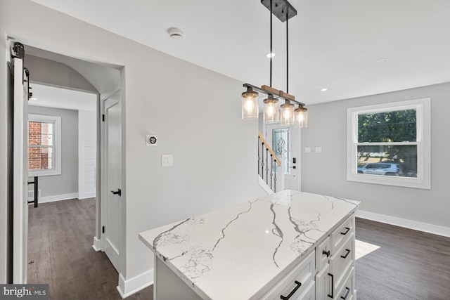 kitchen featuring dark wood-type flooring, white cabinetry, light stone counters, baseboards, and recessed lighting