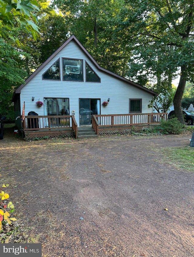 view of front facade with a wooden deck