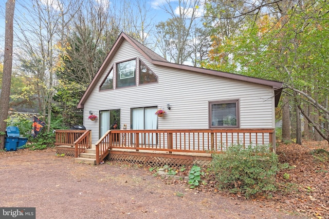 view of front of property featuring a wooden deck