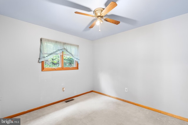 empty room with carpet flooring and ceiling fan