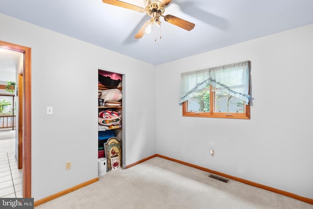 bedroom featuring ceiling fan and light colored carpet