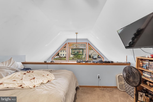 carpeted bedroom featuring lofted ceiling