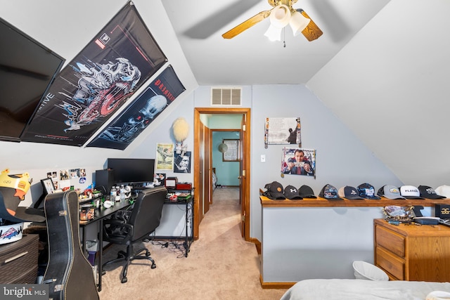 carpeted office featuring ceiling fan and lofted ceiling