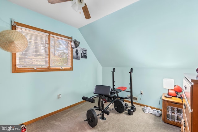 workout area featuring carpet floors, ceiling fan, and lofted ceiling