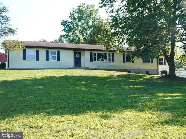 ranch-style home with a front yard