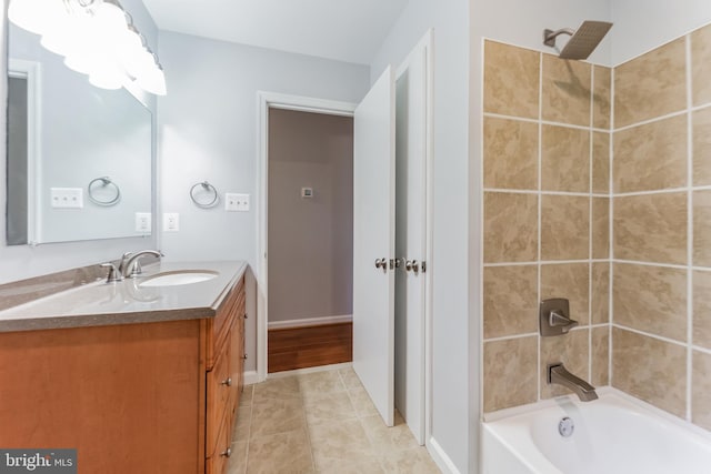 bathroom featuring vanity, tiled shower / bath, and tile patterned floors