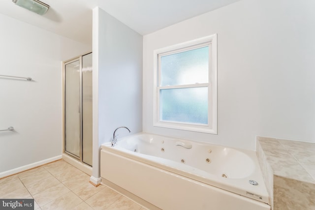 bathroom featuring tile patterned floors and independent shower and bath