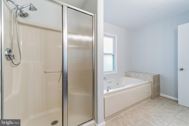 bathroom featuring tile patterned floors and plus walk in shower