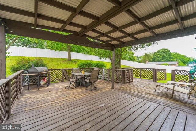 wooden terrace featuring grilling area