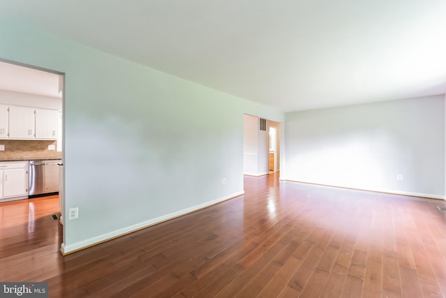 empty room with hardwood / wood-style floors