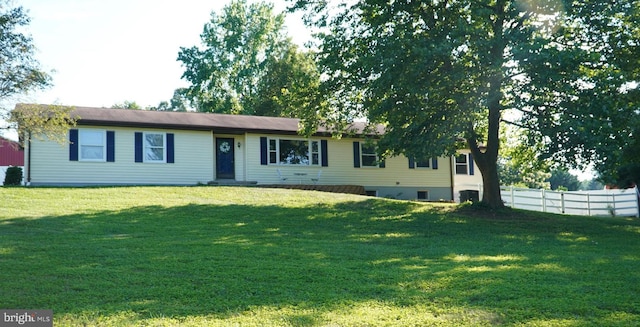 ranch-style house featuring a front lawn