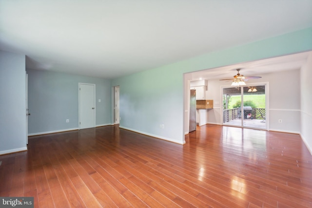 unfurnished living room with hardwood / wood-style floors and ceiling fan