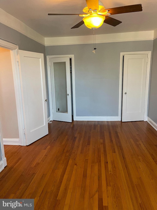 interior space with ceiling fan and hardwood / wood-style flooring