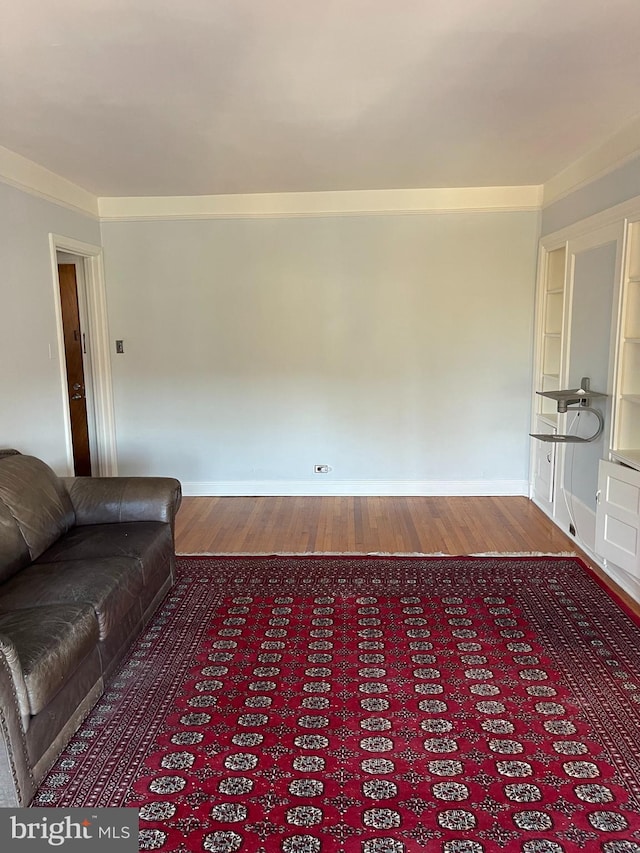 unfurnished living room featuring hardwood / wood-style flooring